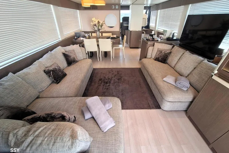 Soul Yacht Photos Pics Luxurious interior of 2022 Azimut Magellano 66 yacht with elegant seating and dining area.