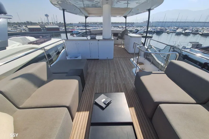 Soul Yacht Photos Pics Luxurious 2022 Azimut Magellano 66 yacht deck with modern seating and marina view.