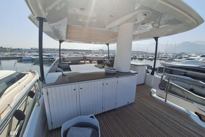 Soul Yacht Photos Pics Azimut Magellano 66 yacht deck, 2022 model, featuring luxurious seating and marina view.