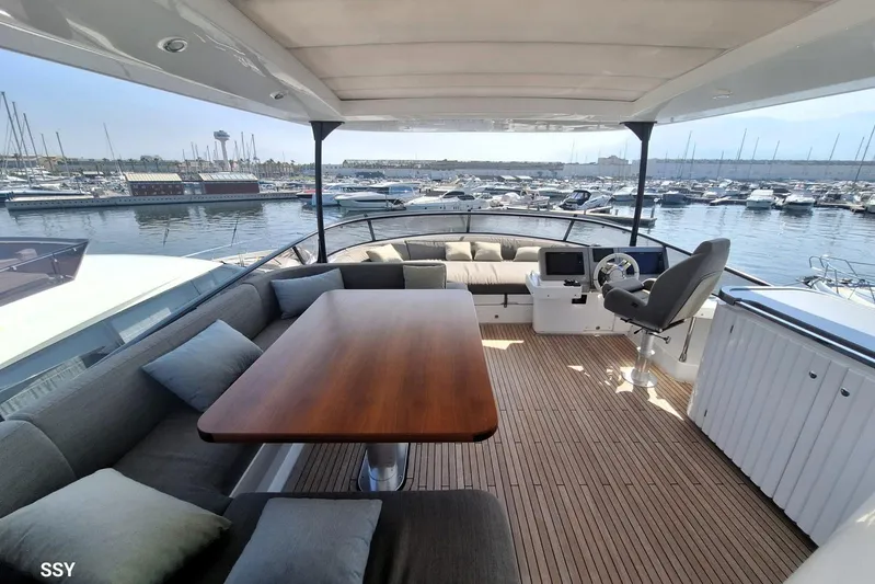 Soul Yacht Photos Pics Luxurious 2022 Azimut Magellano 66 yacht interior with elegant seating and marina view.