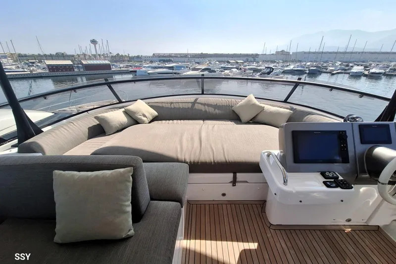 Soul Yacht Photos Pics Luxurious 2022 Azimut Magellano 66 yacht interior with plush seating and marina view.