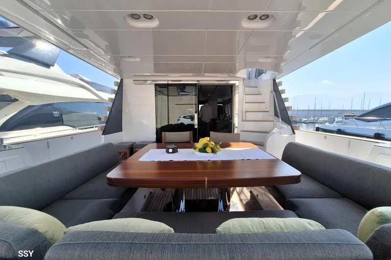 Soul Yacht Photos Pics Luxurious 2022 Azimut Magellano 66 yacht with elegant outdoor dining area.