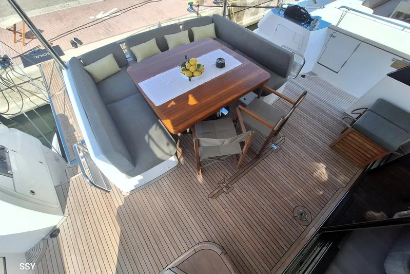 Soul Yacht Photos Pics Luxurious 2022 Azimut Magellano 66 yacht deck with elegant seating and dining area.
