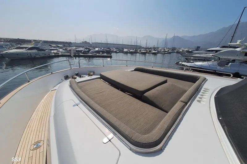 Soul Yacht Photos Pics Luxurious 2022 Azimut Magellano 66 yacht with spacious sunbathing area in marina.