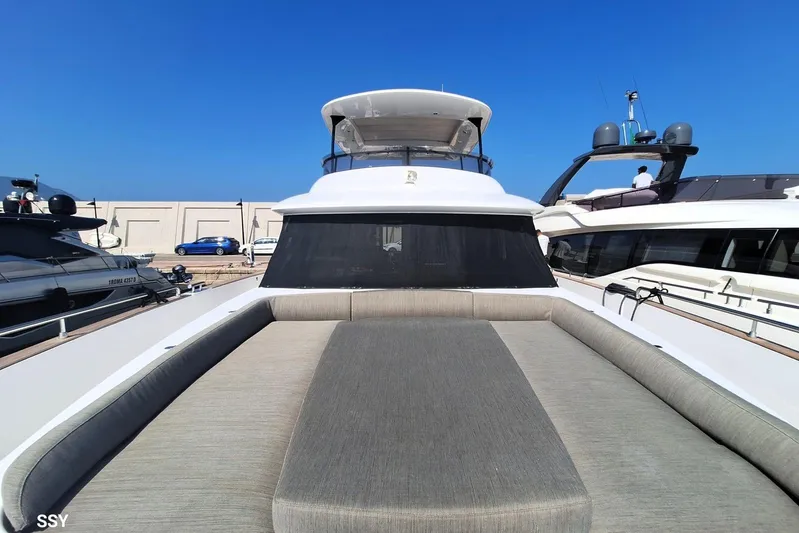 Soul Yacht Photos Pics Azimut Magellano 66 yacht, 2022 model, docked with sunbathing area, clear blue sky.