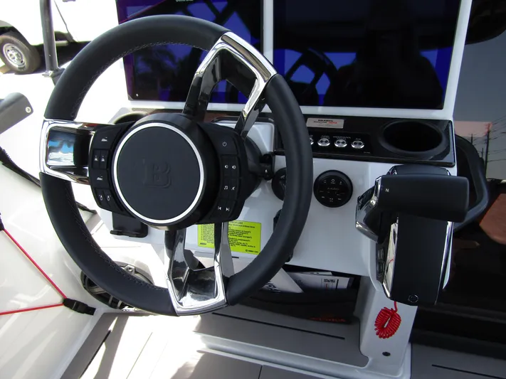  Yacht Photos Pics Steering wheel of 2024 BRABUS SHADOW 300 CT boat, featuring modern controls and sleek design.