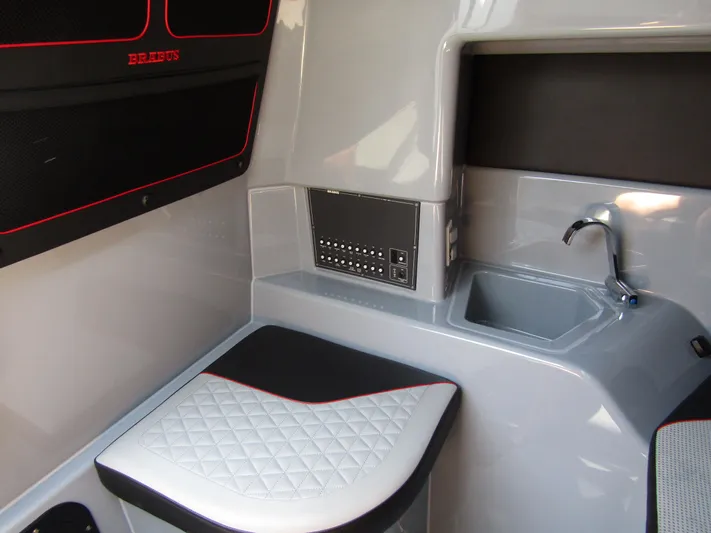  Yacht Photos Pics 2024 BRABUS SHADOW 300 CT interior with sleek seating and compact sink area.