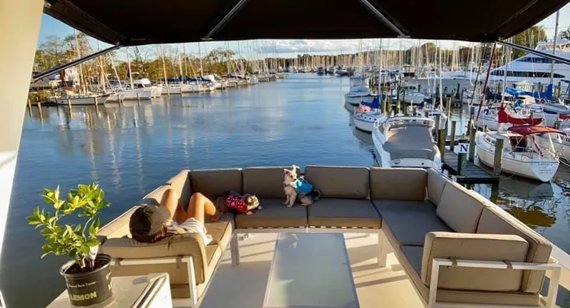 Temptress Yacht Photos Pics 1971 Hatteras 58 Motor Yacht docked with relaxing view.