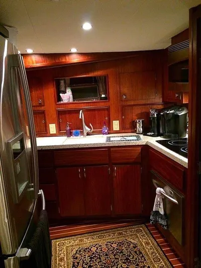 Temptress Yacht Photos Pics 1971 Hatteras 58 Motor Yacht kitchen with wooden cabinetry.
