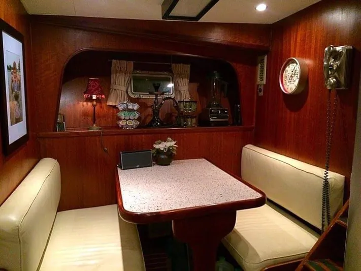 Temptress Yacht Photos Pics Interior of 1971 Hatteras 58 Motor Yacht, cozy dining nook.