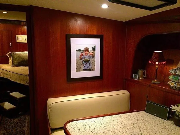 Temptress Yacht Photos Pics Interior of a 1971 Hatteras 58 Motor Yacht with cozy seating area.