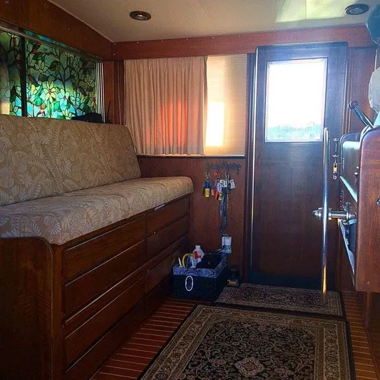 Temptress Yacht Photos Pics Interior of 1971 Hatteras 58 Motor Yacht with wooden furnishings.
