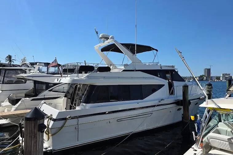  Yacht Photos Pics 1993 McKinna 48 Pilothouse yacht docked at marina under clear blue sky.