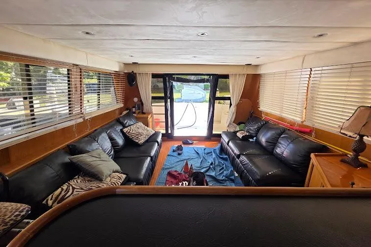  Yacht Photos Pics Luxurious interior of a 1993 McKinna 48 Pilothouse yacht with leather seating and large windows.