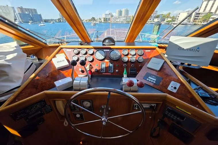  Yacht Photos Pics Pilothouse of 1993 McKinna 48 with navigation equipment and scenic waterfront view.