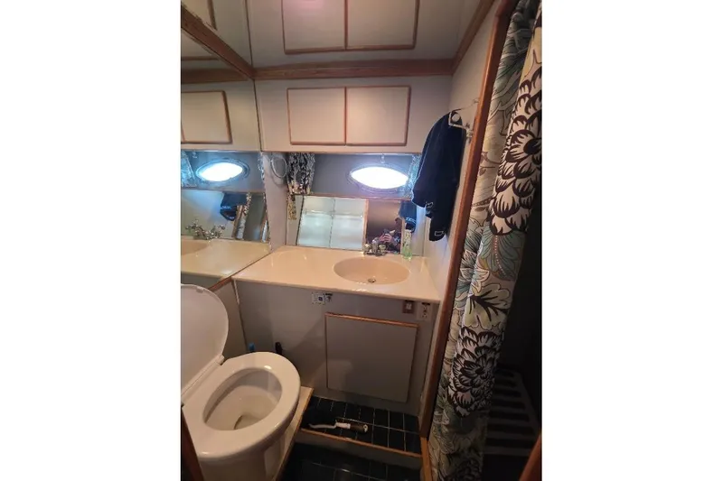  Yacht Photos Pics Bathroom interior of 1993 McKinna 48 Pilothouse yacht with floral shower curtain.
