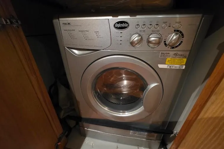  Yacht Photos Pics Splendide washing machine inside a 1993 McKinna 48 Pilothouse yacht's wooden cabinet.
