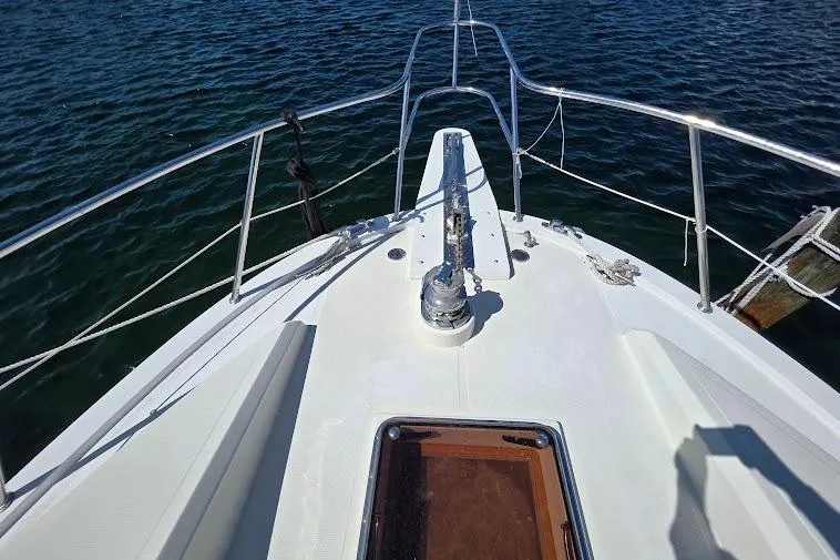  Yacht Photos Pics Bow view of 1993 McKinna 48 Pilothouse yacht on water.