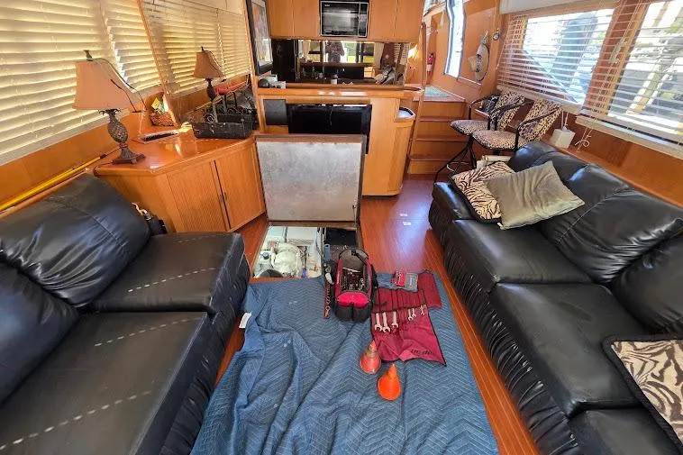  Yacht Photos Pics Interior of 1993 McKinna 48 Pilothouse with leather sofas and kitchen area.