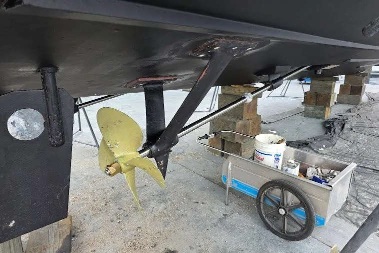  Yacht Photos Pics 1993 McKinna 48 Pilothouse boat under maintenance, showing propeller and repair tools.