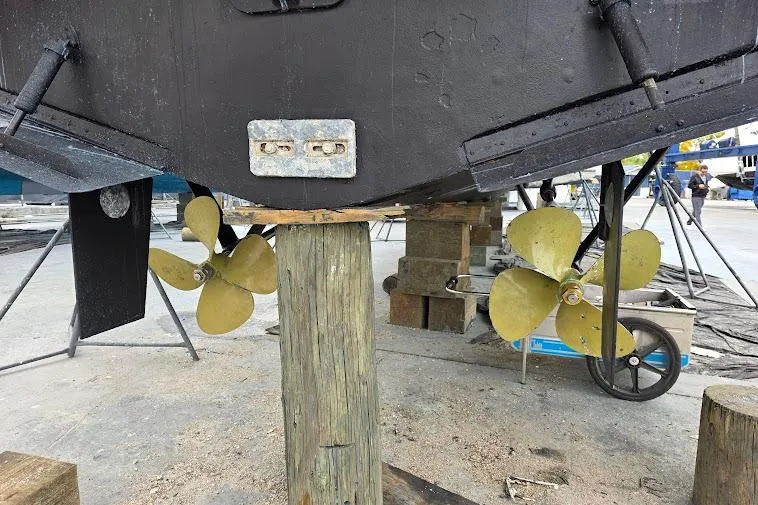  Yacht Photos Pics 1993 McKinna 48 Pilothouse boat propellers and rudders during maintenance.