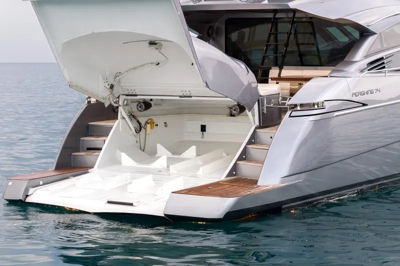 One Spin 2 Yacht Photos Pics Luxury 2017 Pershing 74 yacht with open rear deck on calm water.