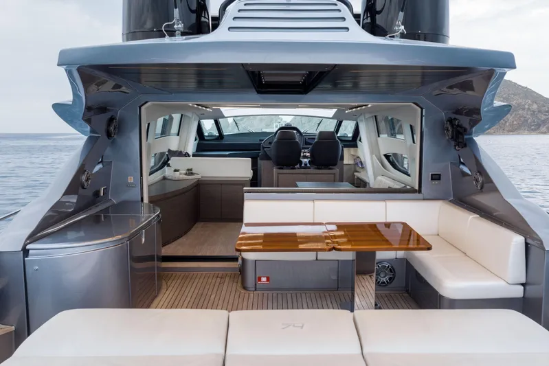 One Spin 2 Yacht Photos Pics Luxurious 2017 Pershing 74 yacht interior with elegant seating and ocean view.