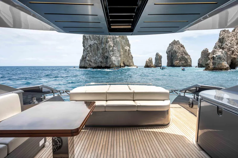 One Spin 2 Yacht Photos Pics Luxurious 2017 Pershing 74 yacht with ocean view and rock formations.