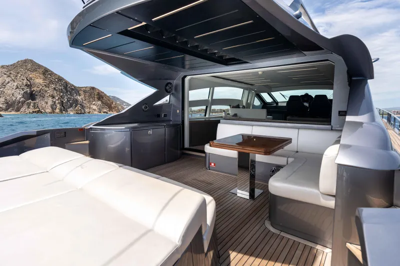 One Spin 2 Yacht Photos Pics Luxurious 2017 Pershing 74 yacht interior with sleek seating and ocean view.