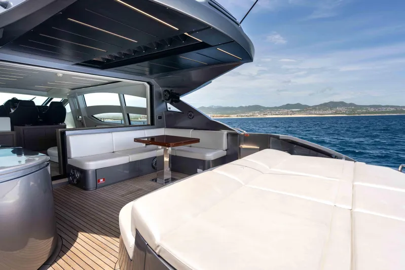 One Spin 2 Yacht Photos Pics Luxurious 2017 Pershing 74 yacht interior with ocean view and elegant seating area.