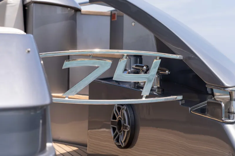 One Spin 2 Yacht Photos Pics 2017 Pershing 74 yacht detail with sleek metallic design and modern features.