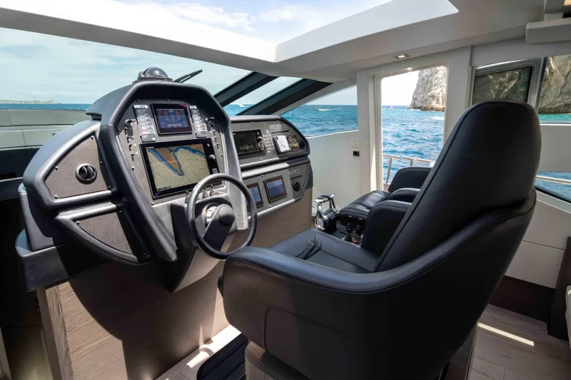 One Spin 2 Yacht Photos Pics Luxurious 2017 Pershing 74 yacht cockpit with advanced navigation systems and ocean view.
