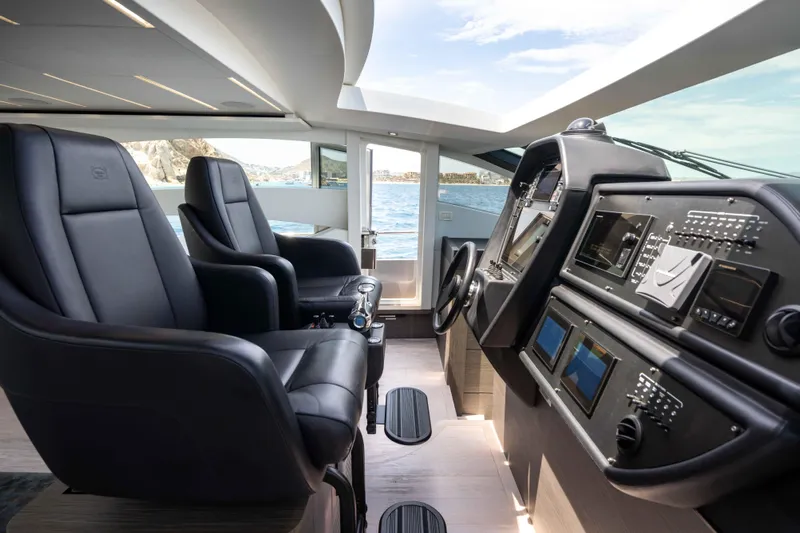 One Spin 2 Yacht Photos Pics Luxurious 2017 Pershing 74 yacht cockpit with leather seats and advanced navigation controls.