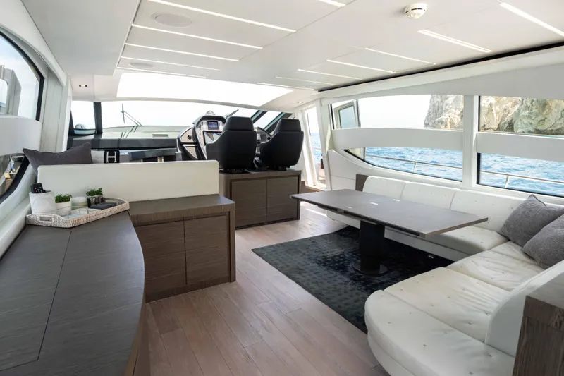 One Spin 2 Yacht Photos Pics Luxurious interior of 2017 Pershing 74 yacht with modern seating and ocean view.