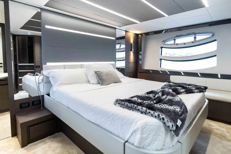 One Spin 2 Yacht Photos Pics Luxurious bedroom interior of 2017 Pershing 74 yacht with modern design and elegant decor.