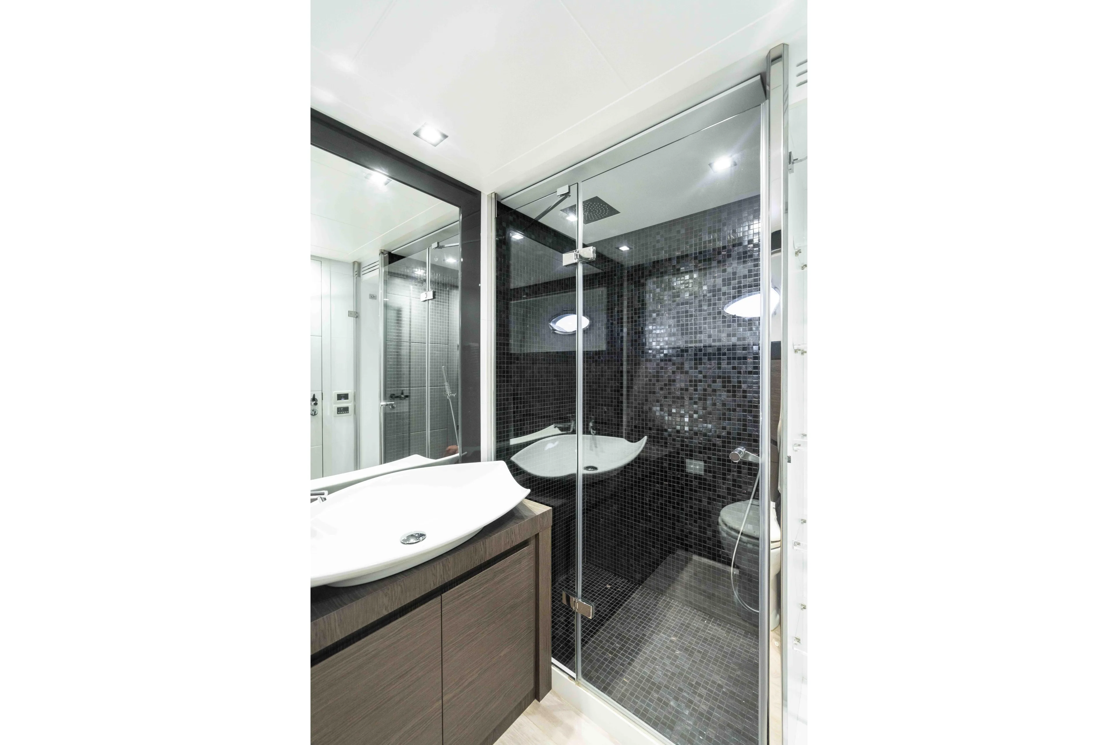 One Spin 2 Yacht Photos Pics Luxurious bathroom in 2017 Pershing 74 yacht with modern fixtures and glass shower.