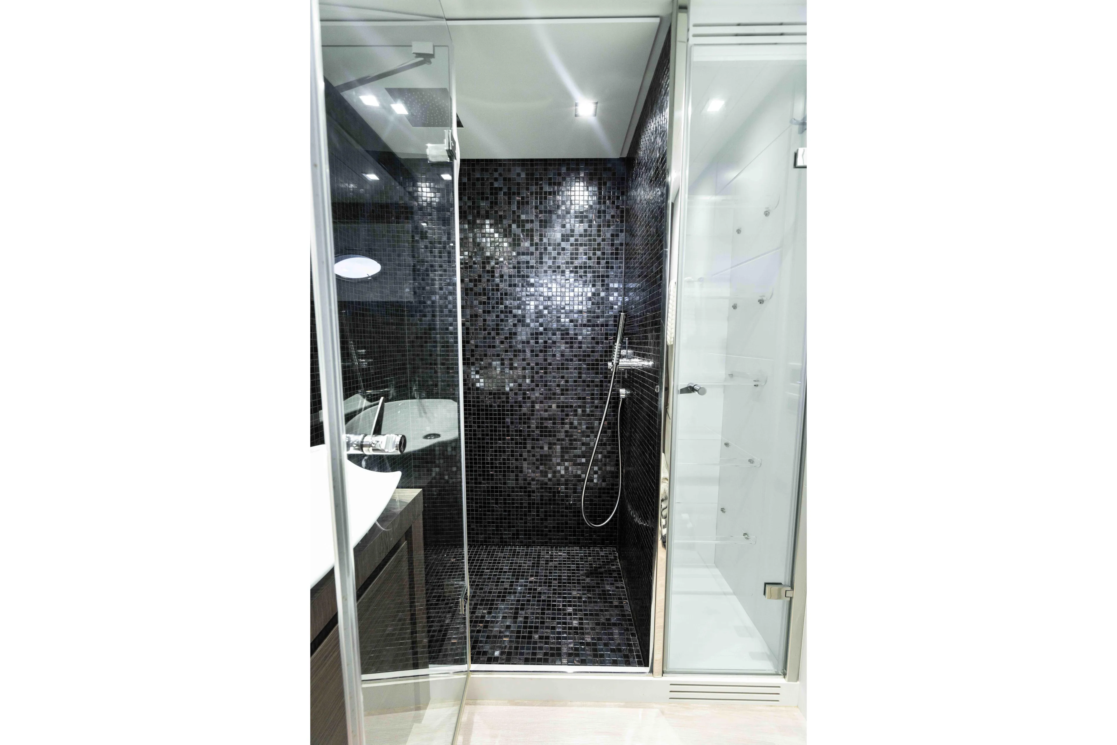 One Spin 2 Yacht Photos Pics Luxurious bathroom with black mosaic tiles in 2017 Pershing 74 yacht.