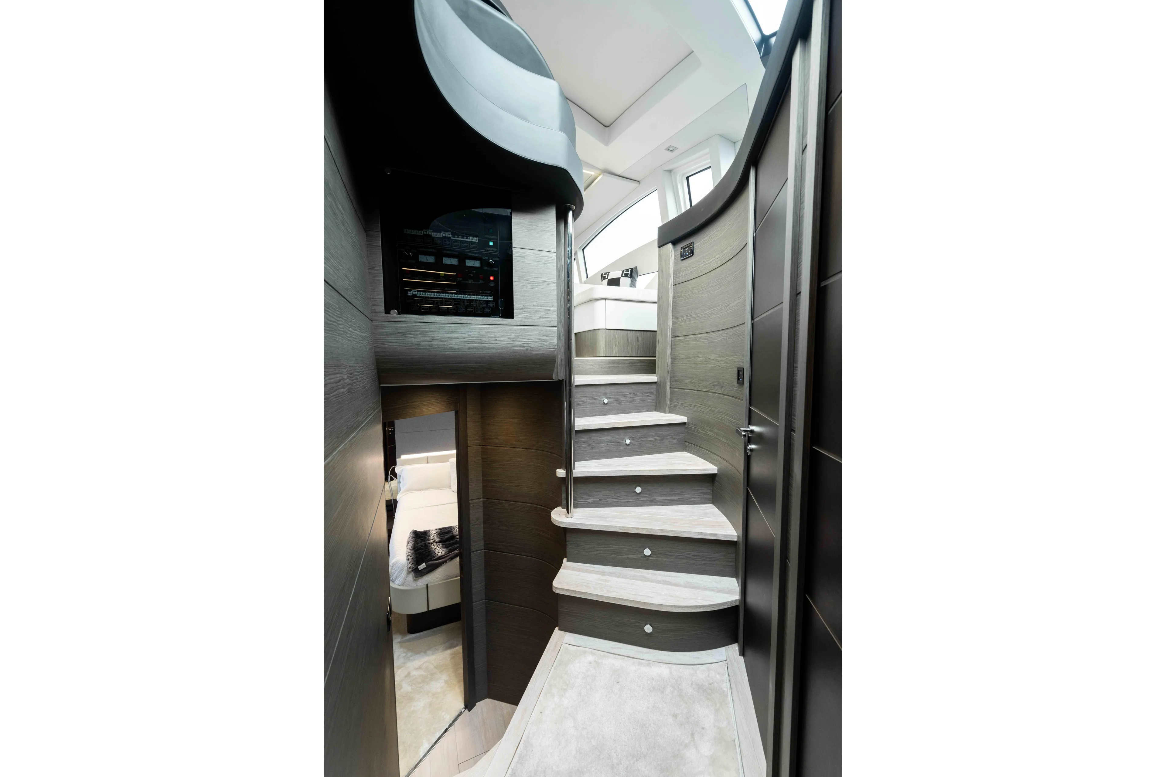 One Spin 2 Yacht Photos Pics Interior staircase of 2017 Pershing 74 yacht, featuring modern design and luxurious materials.