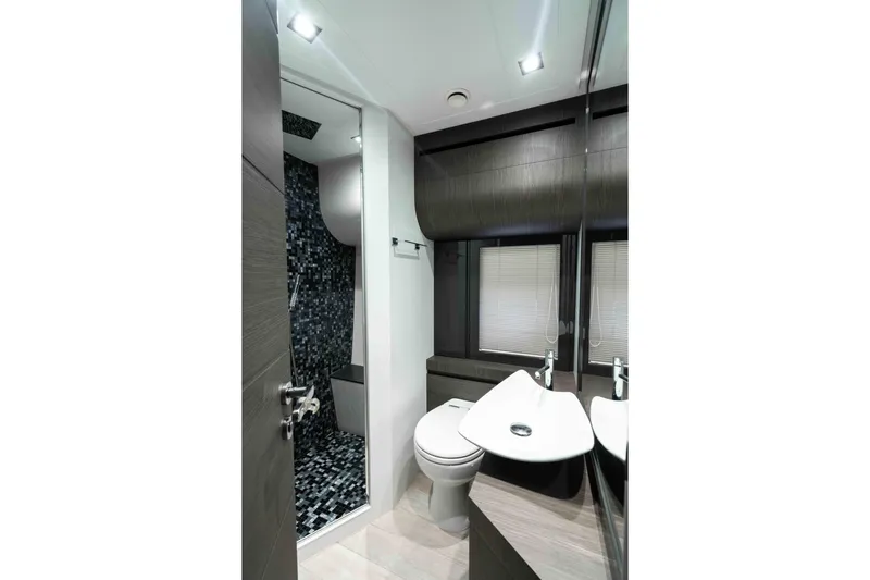 One Spin 2 Yacht Photos Pics Luxurious bathroom in 2017 Pershing 74 yacht with modern fixtures and sleek design.