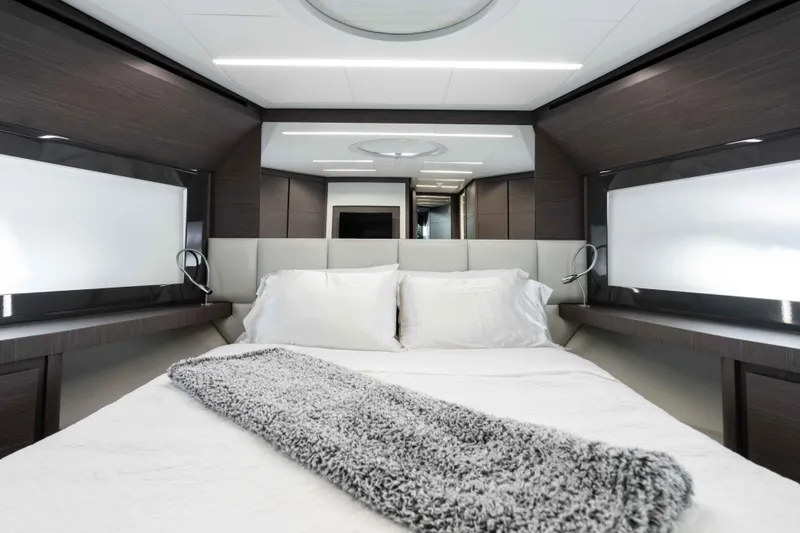 One Spin 2 Yacht Photos Pics Luxurious bedroom interior of 2017 Pershing 74 yacht with modern design and cozy bedding.