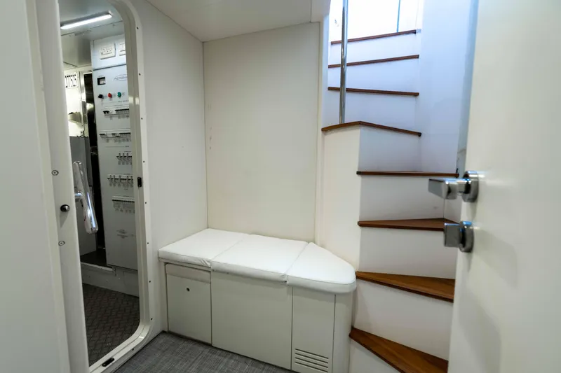 One Spin 2 Yacht Photos Pics Interior of 2017 Pershing 74 yacht with stairs and control room access.