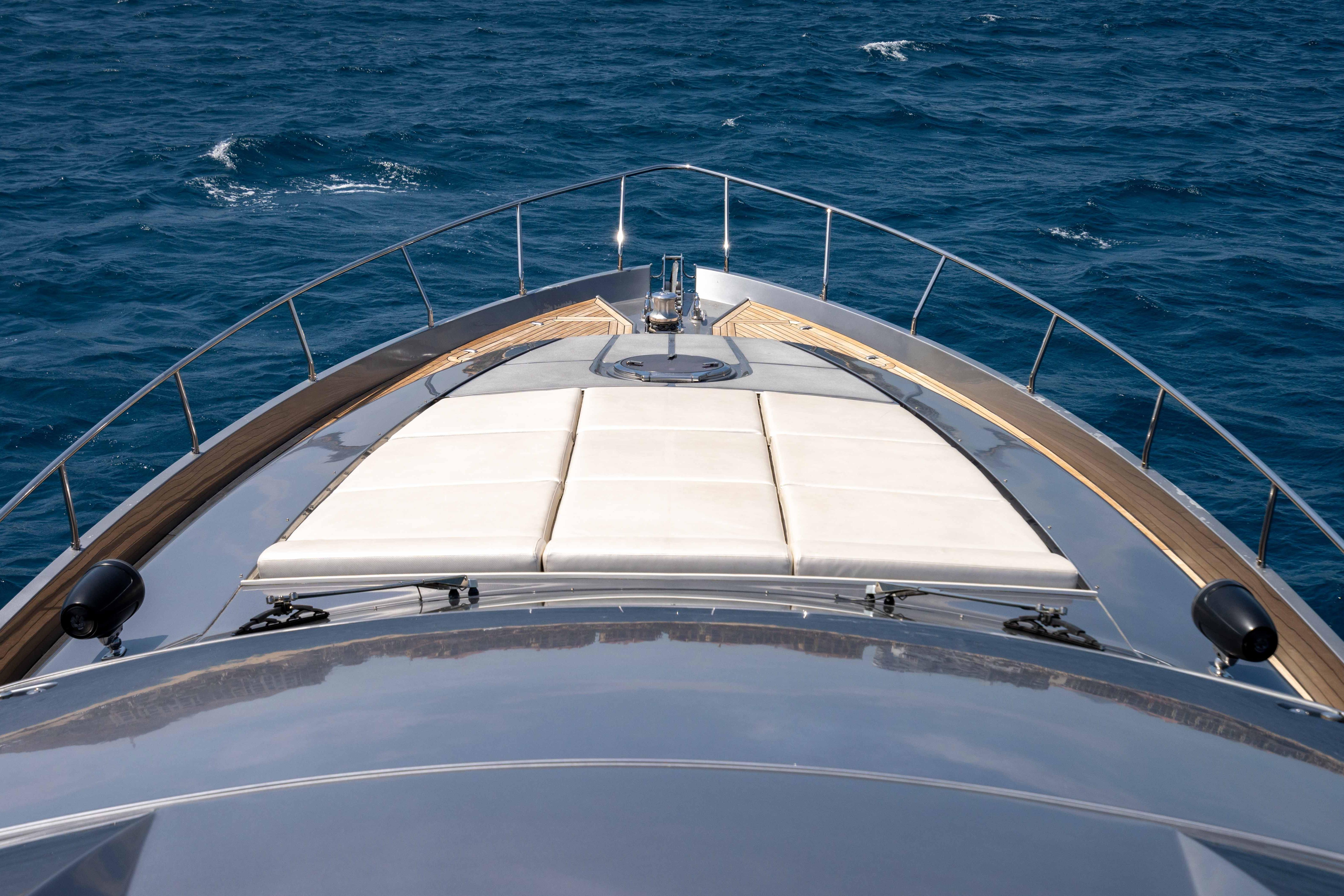 2017 Pershing 74 yacht bow view on open sea.