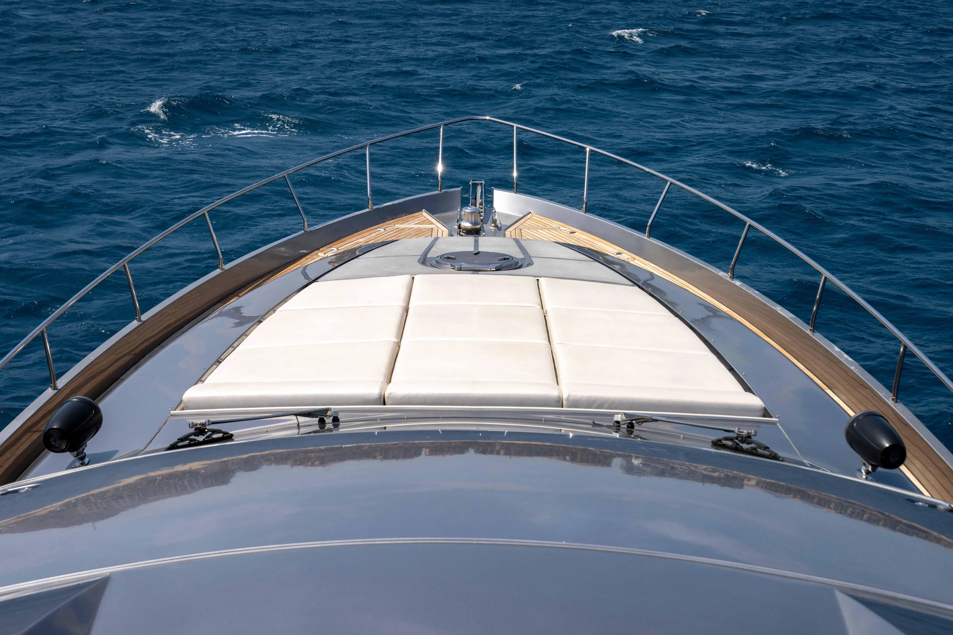 2017 Pershing 74 yacht bow view on open sea.