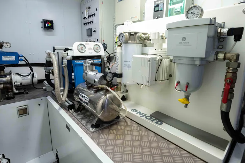 One Spin 2 Yacht Photos Pics Engine room of a 2017 Pershing 74 yacht, featuring advanced mechanical equipment.