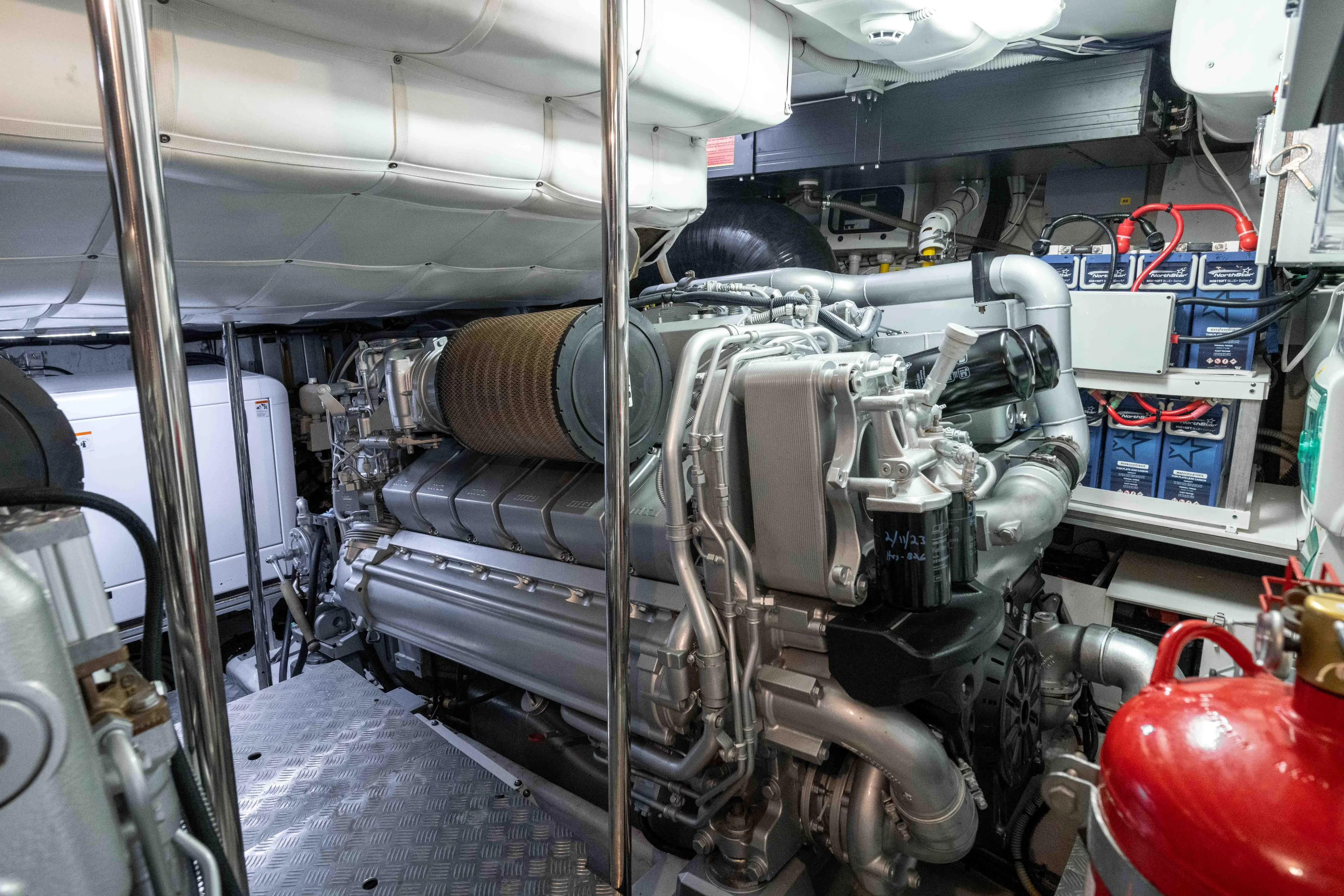 One Spin 2 Yacht Photos Pics Engine room of a 2017 Pershing 74 yacht, showcasing advanced machinery and equipment.