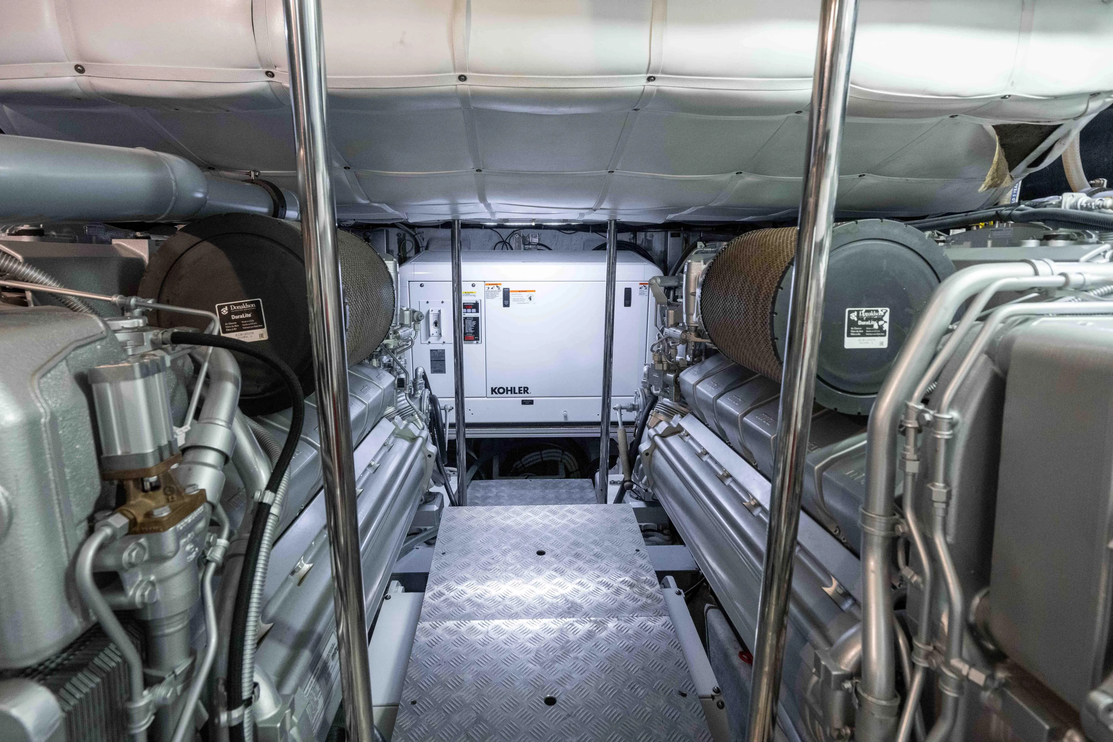 One Spin 2 Yacht Photos Pics Engine room of a 2017 Pershing 74 yacht with Kohler generator.