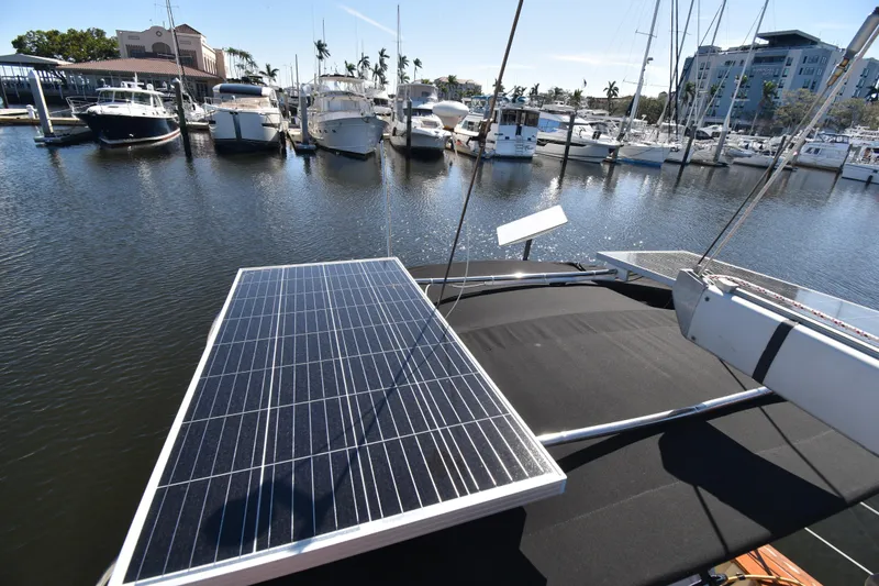 Aftia Yacht Photos Pics Sailboat with solar panels docked at marina, Island Packet 380, 1999 model.