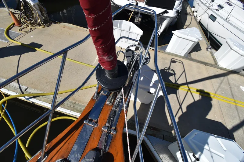 Aftia Yacht Photos Pics Bow of 1999 Island Packet 380 sailboat docked, showing deck fittings and mooring lines.