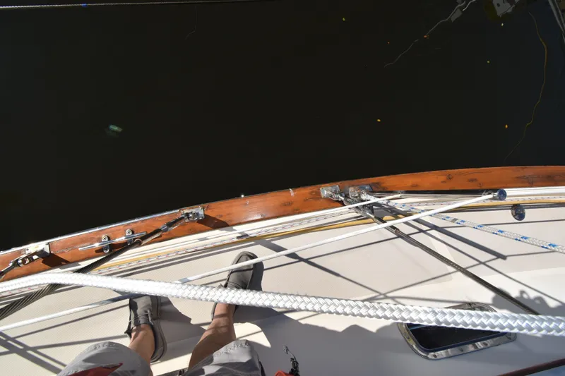 Aftia Yacht Photos Pics Top view of 1999 Island Packet 380 sailboat deck with ropes and wooden trim.