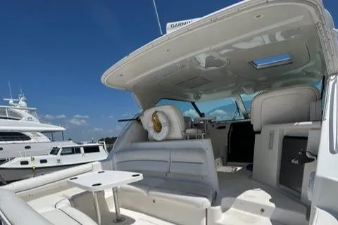  Yacht Photos Pics 2007 Tiara Yachts 4300 Sovran interior with seating and table under clear blue sky.